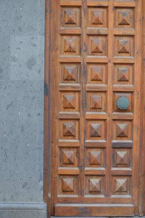 Old wooden door with decorative elements, close-up of photo.の写真素材