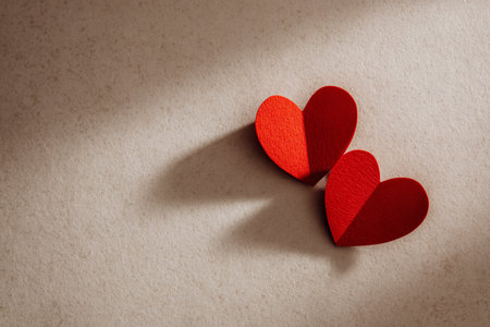 Two red paper hearts on a light background. Valentine's day concept.の素材