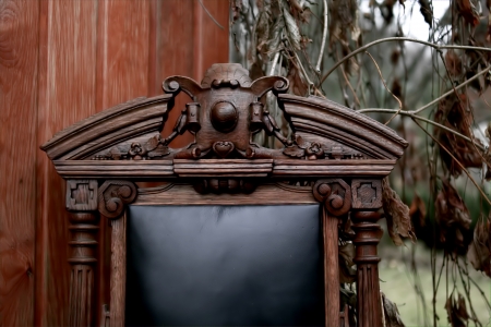 beautiful old chair in details, focused on chair, soft focus on background, outdoor shotの写真素材