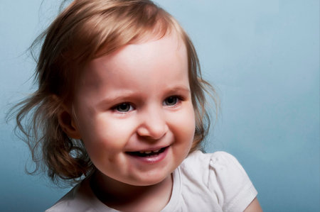 Portrait of a sweet baby girl of two, studio shot