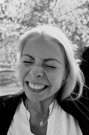 Portrait of the happiest young woman ever, monochrome outdoor portraitの写真素材