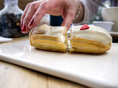Female hand over a sliced brownie, close up shot with selective focus