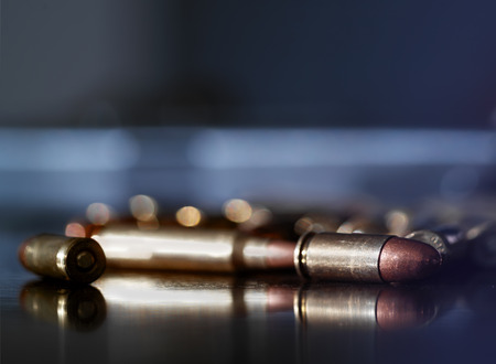 Assorted bullets on a table, indoor shot with shallow depth of fieldの写真素材