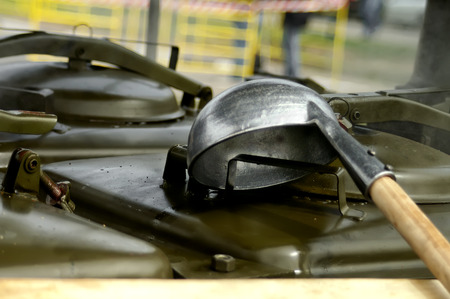Closeup of a field kitchen with a ladle on the top, warning tape in the blurred backgroundの写真素材