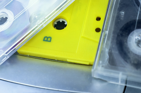 Still life of a number of audio cassettes, selective focus macro shot in artificial lightの写真素材