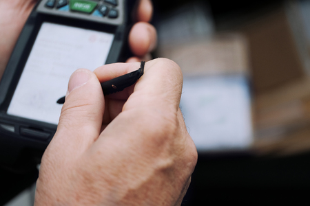 Working In Warehouse With Mobile Computerの写真素材