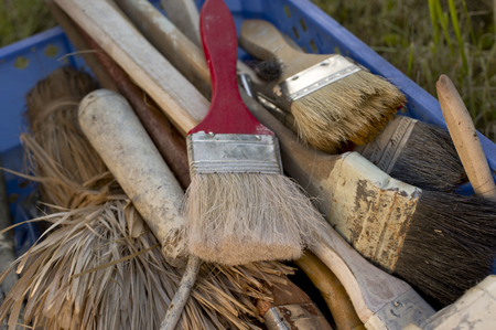 House painting brushes placed in a plastic box, closeup photoの写真素材