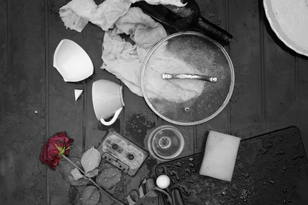 Uncleared plastic table after party under rain, overhead view, selective colorの写真素材