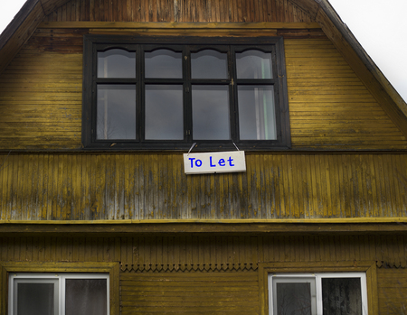 Old wooden house to let, outdoor cropped shotの写真素材