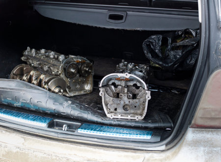 Disassembled car engines  transporting in a trunk, outdoor closeup