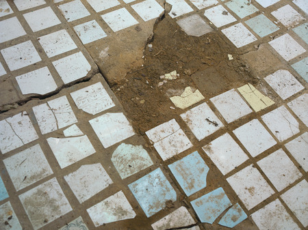 Dirty damaged tiled floor, above view shotの写真素材