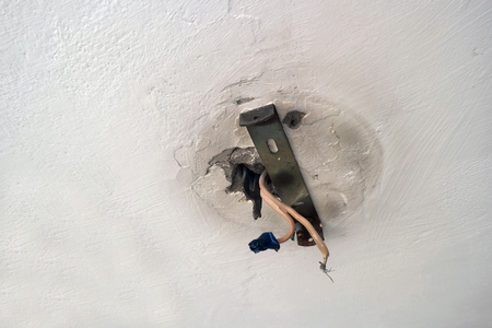 Electrical tape on live wires mounted on the wall or ceilingの写真素材