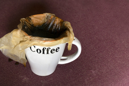 Coffee mug with handmade filter on the top, studio closeupの写真素材