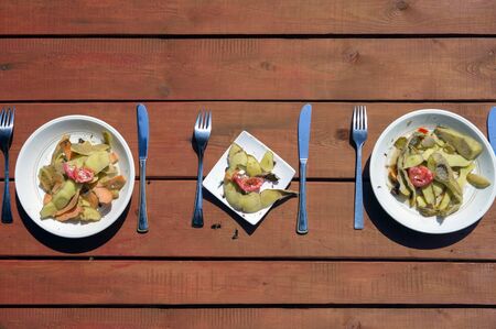 overhead shot of a served table and plates full of leftoversの写真素材