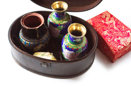 Collection of vintage vases and decorated box on a white table