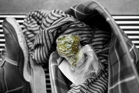 marijuana in plastic bag found in personal effects, selective color shotの写真素材