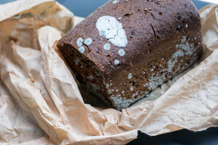 Moldy bread on a paper bag definitely gone off, indoor closeupの写真素材