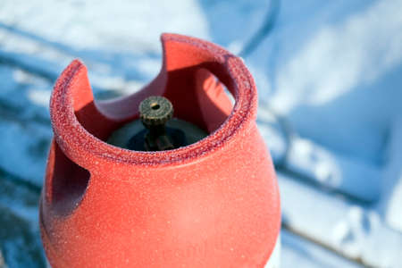 Frozen LPG bottle close up, winter closeup shot, shallow DOFの写真素材