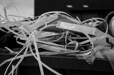 A container full of construction trash, in black and whiteの写真素材