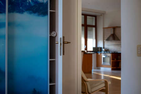 Open door in contemporary looking apartment, shallow DOFの写真素材