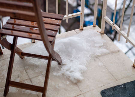 Closeup of a tiled floor covered with melting iceの写真素材