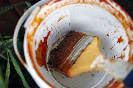 Macro shot of abandoned, dried brush in painting can