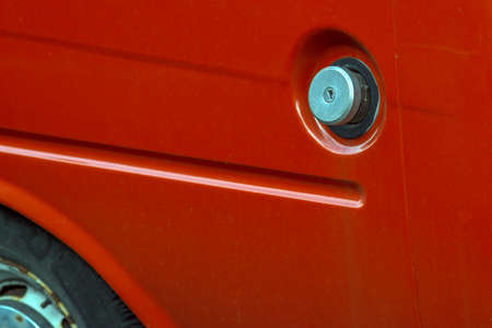 red car fuel tank lock cap, outdoor close upの写真素材