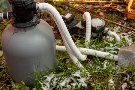 a water filter and pump covered with morning frost, til shift shotの写真素材