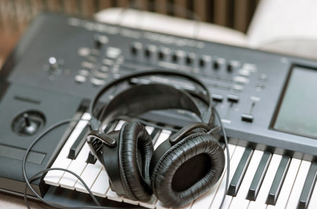 a headphones on a synthesiser keyboard, shallow DOF indoor shotの写真素材