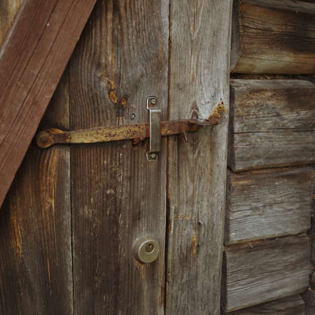 ccon old wooden door, outdoor shot, square composition