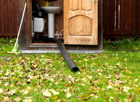 A drainage pipe coming out of a toilet or shower, outdoor shotの写真素材