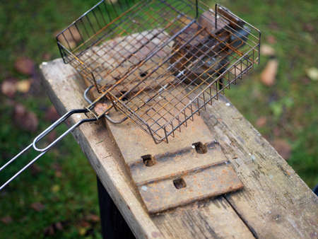 Closeup of a dirty and rusty barbecue grill, shallow DOFの写真素材