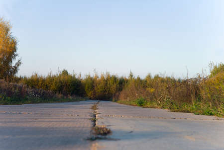 A countryside landscape with a dead end road, summertime shotの写真素材