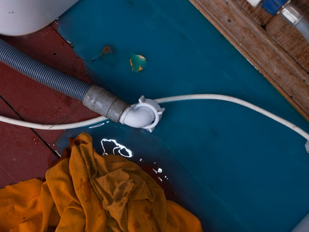 Blue liquid from a washing machine on the floor, indoor closeupの写真素材