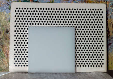 white balance checker in front of a canvas with abstract painting, indoor closeupの写真素材