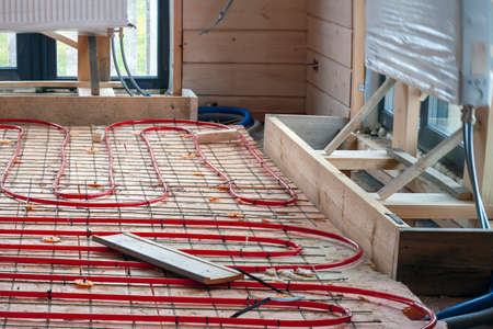 maintenance of underfloor heating system in not finished house, shallow DOFの写真素材