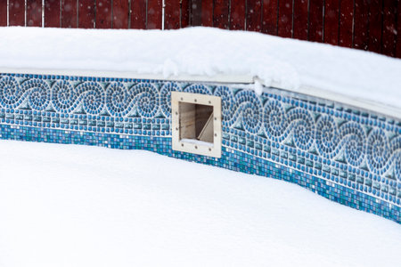 Above ground swimming pool during a blizzard, winter sceneryの写真素材