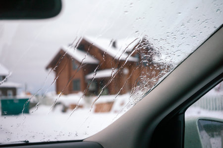 melting ice or snow on a windshield, winter sceneの写真素材
