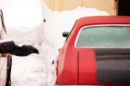 red retro american muscle car and snowdrifts, winter sceneの写真素材