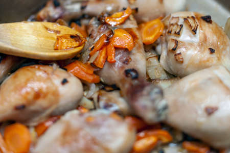 slightly burnt chicken and vegetables, shallow depth of field shotの写真素材