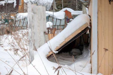 a tilt shift image of damaged house in abandoned town, winter sceneの写真素材