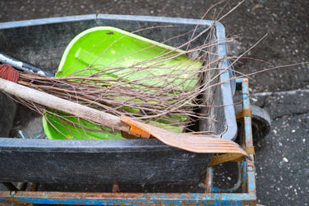 shovel, broom and brush in a trolley, outdoor close upの写真素材