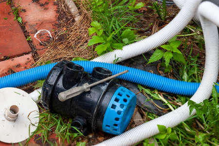 replacement or cleaning of water filter top, outdoor shot without peopleの写真素材