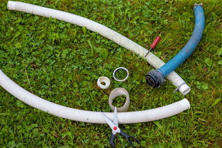 disconnected water hoses ready to get fixed to prevent leak, outdoor closeupの写真素材
