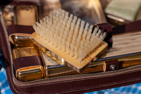 Brown leather travel case with brush for clothes and other personal effectsの写真素材