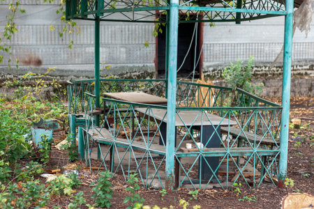 old shabby metal gazebo and mess around it, outdoor shotの写真素材