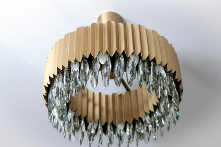 a posh looking chandelier hanging on the ceiling, indoor close upの写真素材