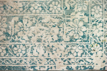 old wool slightly faded carpet, overhead close up shotの写真素材