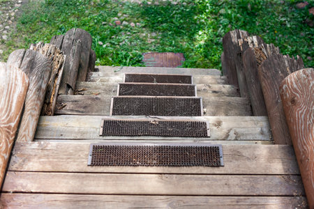 anti slippery mats on rotten wood steps of a house leading down, outdoor shot, no peopleの写真素材
