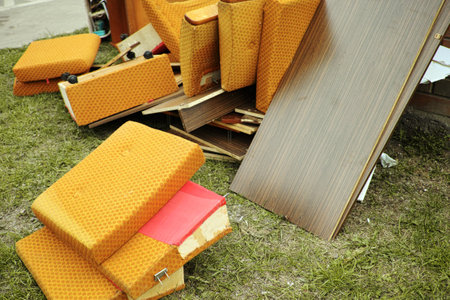old sofa parts discarded in the street, daylight outdoor shotの写真素材